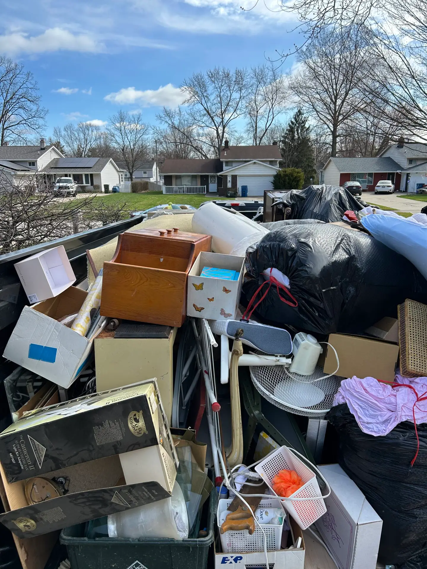 A full trailer load of household items and bagged debris from a residential estate cleanout in North Olmsted, Ohio.